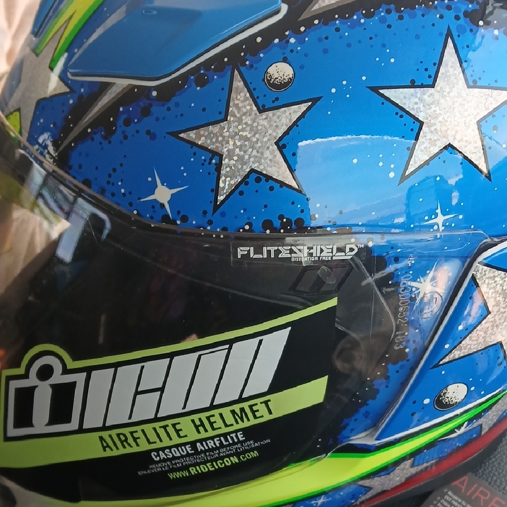 NEW Motorcycle Mens Large ICON Airflite Helmet with Blue and Green Star Design